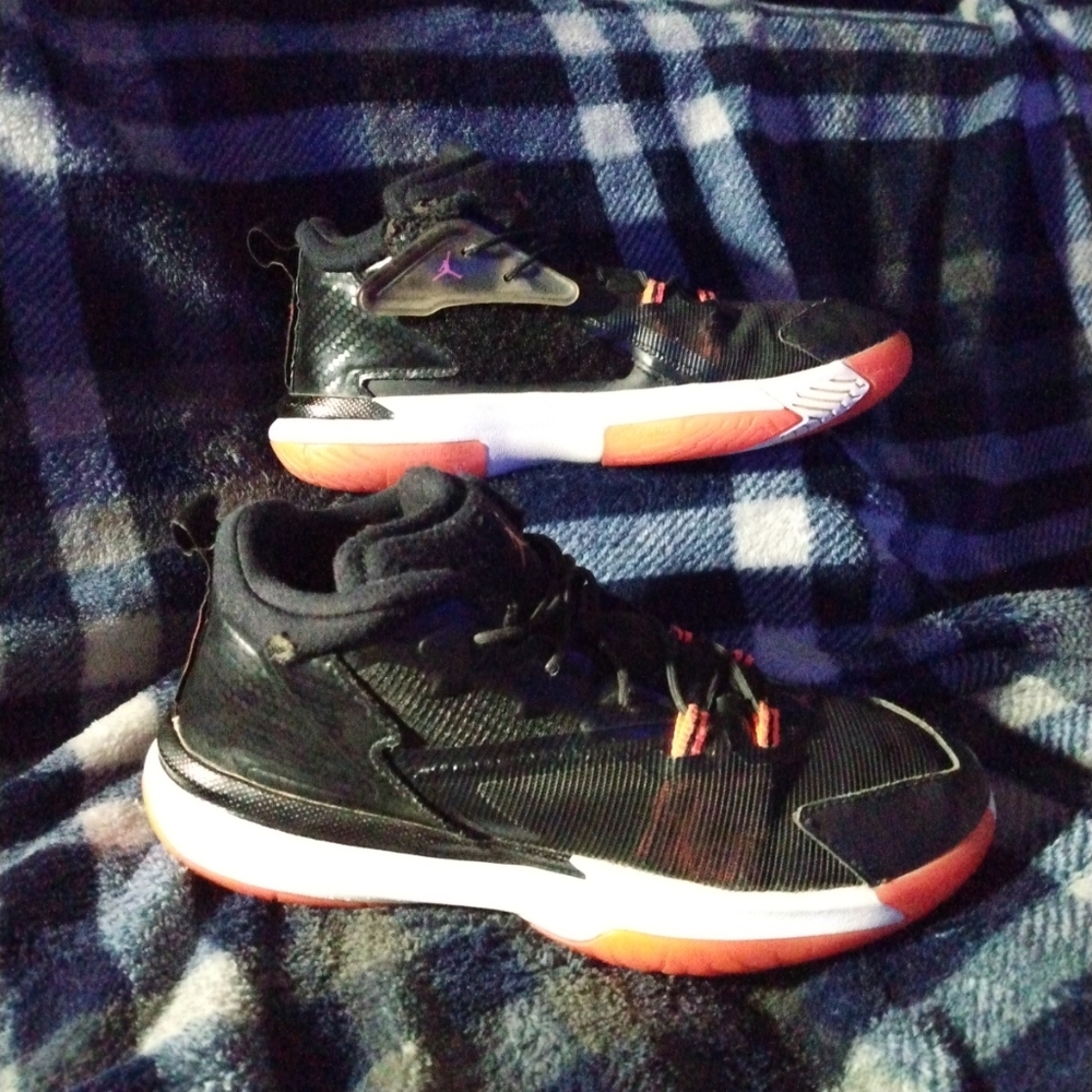 Big kid/boy size 3y Jordan Zion 1 shoes in black, white, and neon orange/red.
